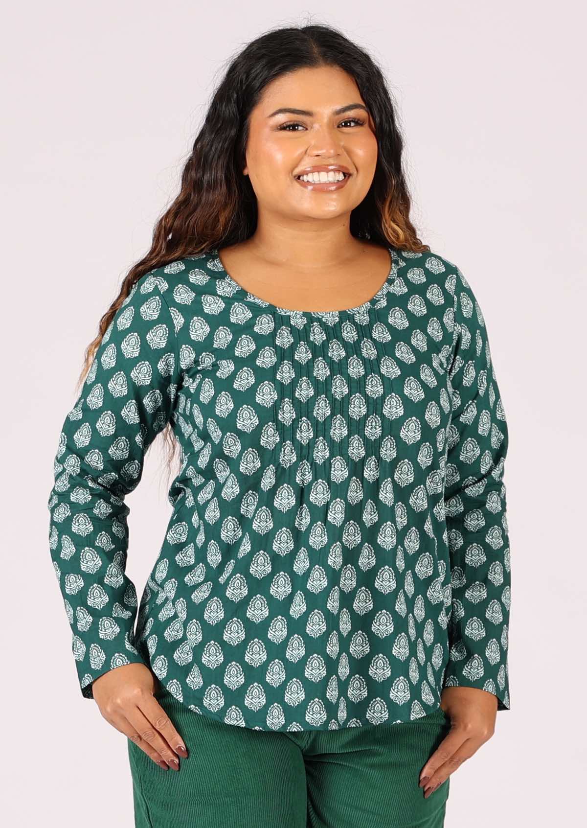 Lightweight cotton top looks great loose or tucked in for work or play