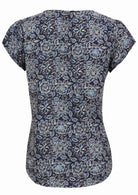 Back view of navy blue based floral print cotton top on a white background.