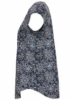 Side view of navy blue based floral print cotton top with cap sleeves.