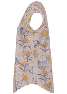 Side view of neutral based floral print cotton top with cap sleeves.