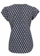 Back image of short sleeve cotton top with navy blue based floral print.