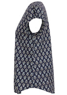 Side image of short sleeve cotton top with navy blue based floral print.