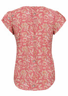 Back view of rose pink based vintage style floral print cotton top on a white background.