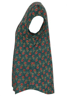 Side view of bottle green based motif in red, pink, green, and mustard floral print cotton top.