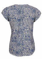 White based blue floral print cotton top with cap sleeves.