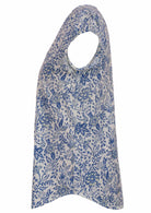 White based blue floral print cotton top on a white background.