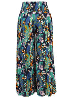 Back of wide leg rayon pants with a wide shirred waistband, in multicoloured floral and peacock print