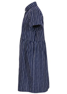 Side view of shikari print on dark blue base cotton relaxed fit collared short sleeve dress with hidden side pockets