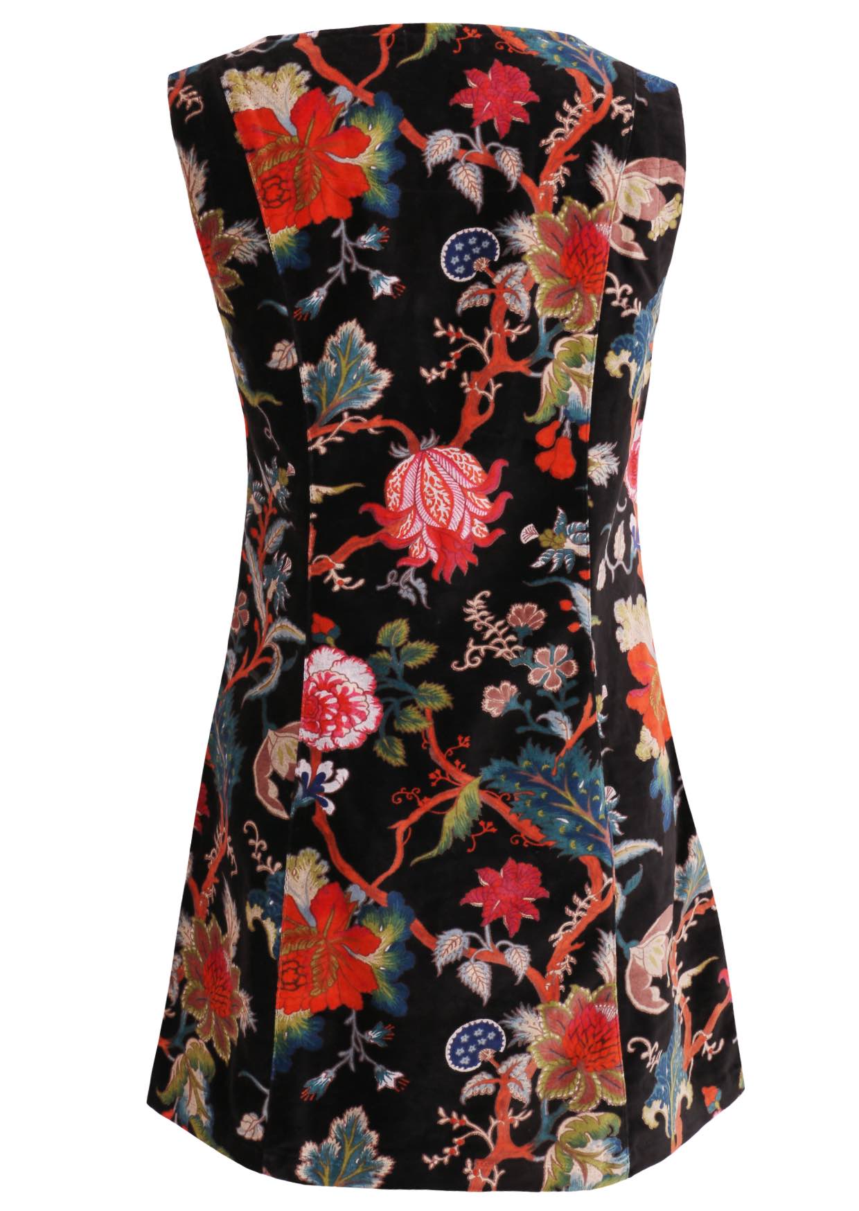 Back view of black based multi-coloured floral print cotton velvet sleeveless tunic with side zip