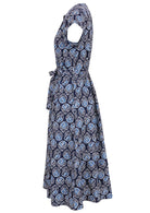 Side view of 50's style cotton button through midi length dress with a waist tie and hidden side pockets