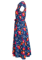 Side view of 50's style cotton button through midi length dress with a waist tie and hidden side pockets
