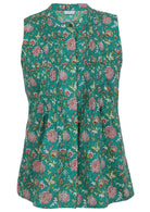 This is the front view of a jade green sleeveless blouse with a red, pink and white floral print, a button-up collar, and vertical pleats, featuring a fitted design and slightly flared hem for a flattering silhouette.