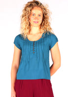 Model wears gorgeous blue 100% cotton cap sleeve top with buttons on chest