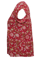 Side mannequin photo of cotton cap sleeve top in floral print on cranberry base