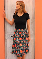 100% cotton botanical print on black base A-line skirt with hidden side zip