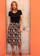 Over the knee cotton A-line skirt can be worn on the waist or lower to the hips