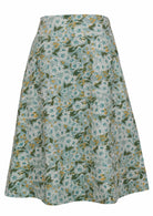 Side view of a sage green based floral print A-line cotton skirt with hidden side zipper