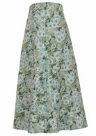 Back view of 100% cotton skirt with hidden side zip and wide waistband in sage green based floral print.