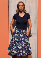 Blue floral and bird print on navy blue base cotton A-line skirt with wide waistband