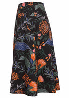 Side view of a black botanical print A-line cotton skirt with hidden side zipper