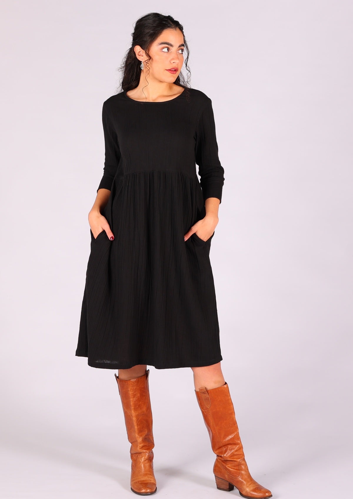 Double cotton black knee length dress with round neckline and hidden side pockets