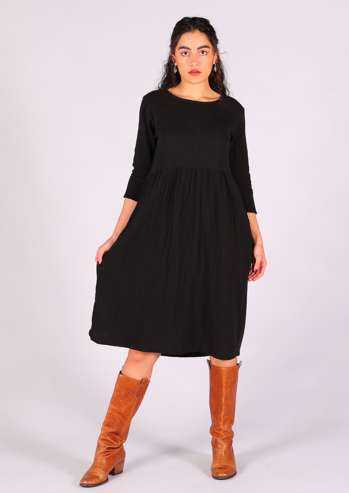 Relaxed fit black dress made out of two layers of lightweight cotton gauze basted together