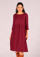 Below the knee loose fit dress with 3/4 sleeves with cuff detail and round neckline