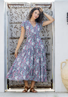 Model wears rayon maxi dress with tiered, voluminous skirt and elasticised waistband