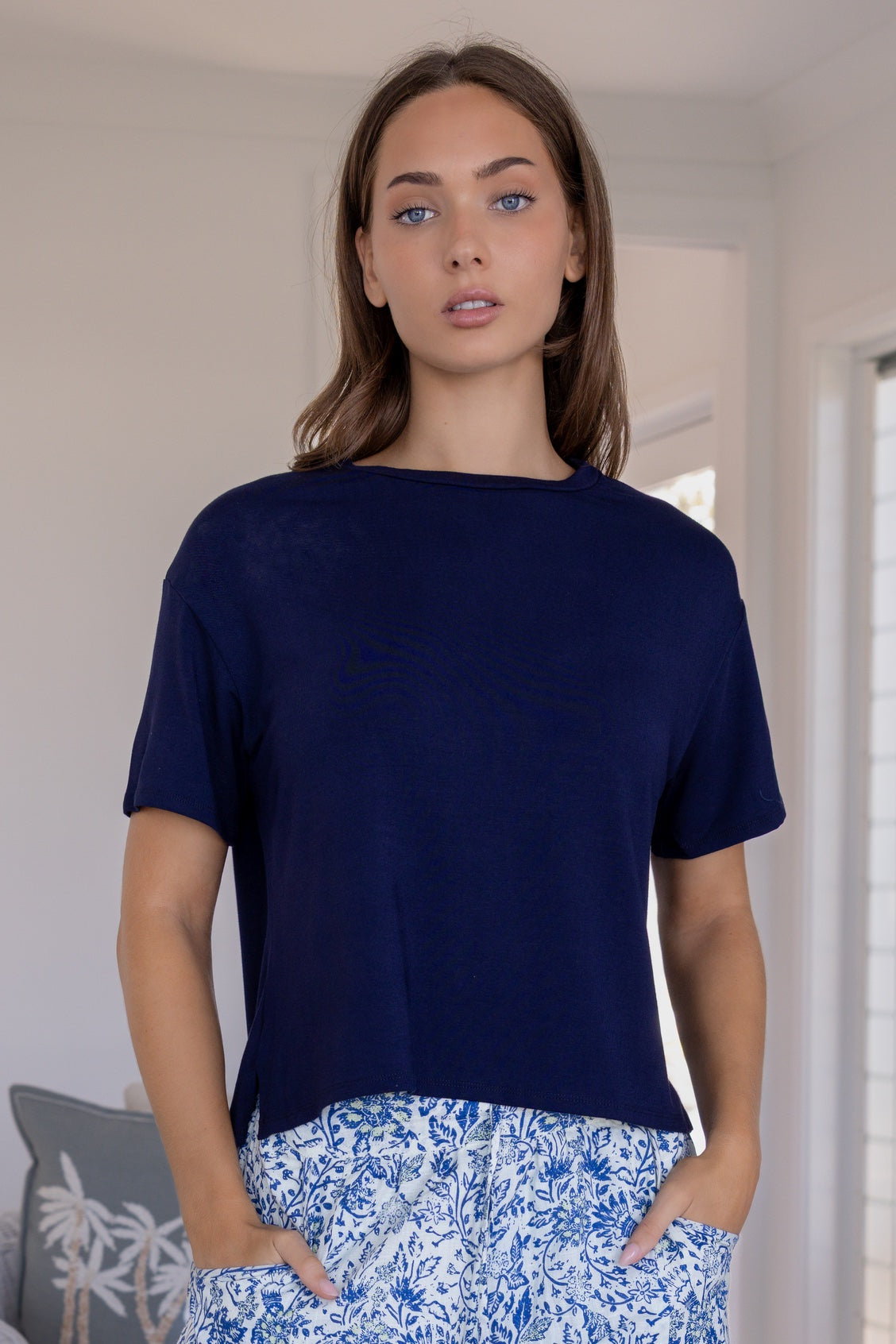 Woman wearing a navy blue relaxed fit stretch rayon t-shirt