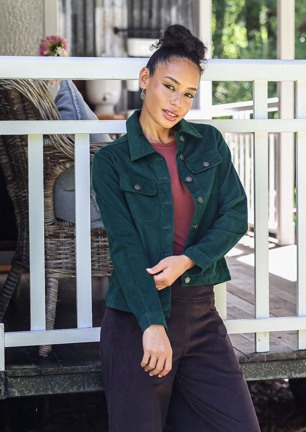 Woman wearing a deep blue-green cotton corduroy jacket paired with plain corduroy pants