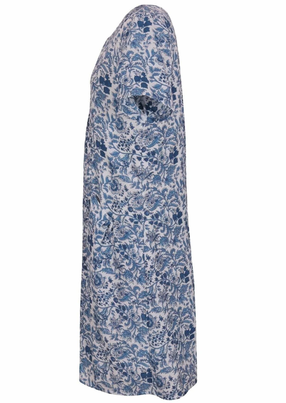 Side view of cotton dress with round neckline and short sleeves in white based blue floral print. 