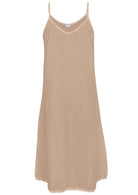 Nude cotton voile slip dress with adjustable spaghetti straps, V-neckline, side splits and a picot trim hem, front view
