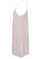 White cotton slip dress with thin adjustable spaghetti straps and a V-neckline, side view