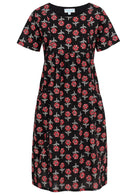 Front view of cotton dress with round neckline in black based floral print