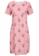 Front view of cotton dress with round neckline in pink striped white based floral print