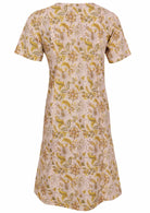 Back view of cotton dress with round neckline in cream based floral print. 