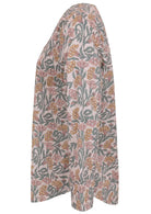 Side image of long sleeve cotton top with white based floral print.