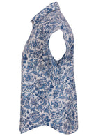 Side view of loose fit shirt style cotton top with collar in white based blue floral print