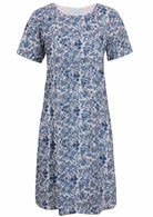 Front view of cotton dress with round neckline in white based blue floral print
