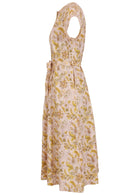 Side view of 50's style cotton button through midi length dress with a waist tie and hidden side pockets