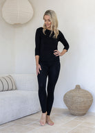 Woman wearing a leggings high waisted full length soft rayon black | Karma East Australia