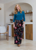 Woman wearing a 100% cotton velvet floral pants with wide waistband and a side zip