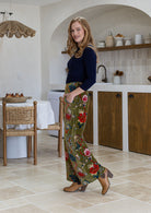 Woman wearing a 100% cotton velvet floral pants with wide waistband and a side zip