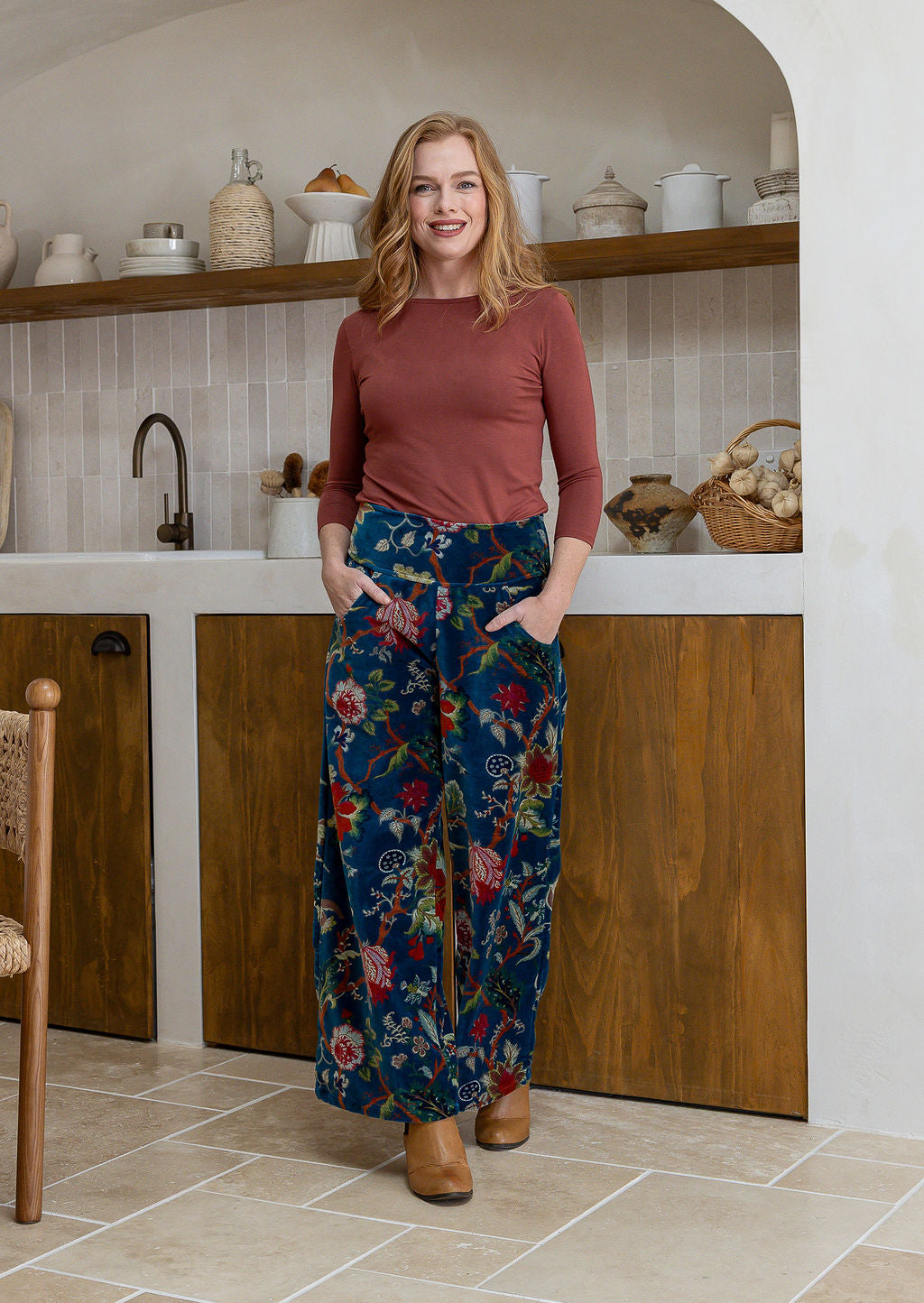Woman wearing a 100% cotton velvet floral pants with wide waistband and a side zip