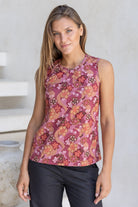 Woman wearing a sleeveless 100% cotton top with round neckline in warm toned Japanese style print