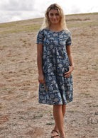 100% cotton dress with short sleeves, pockets and gathers under bust