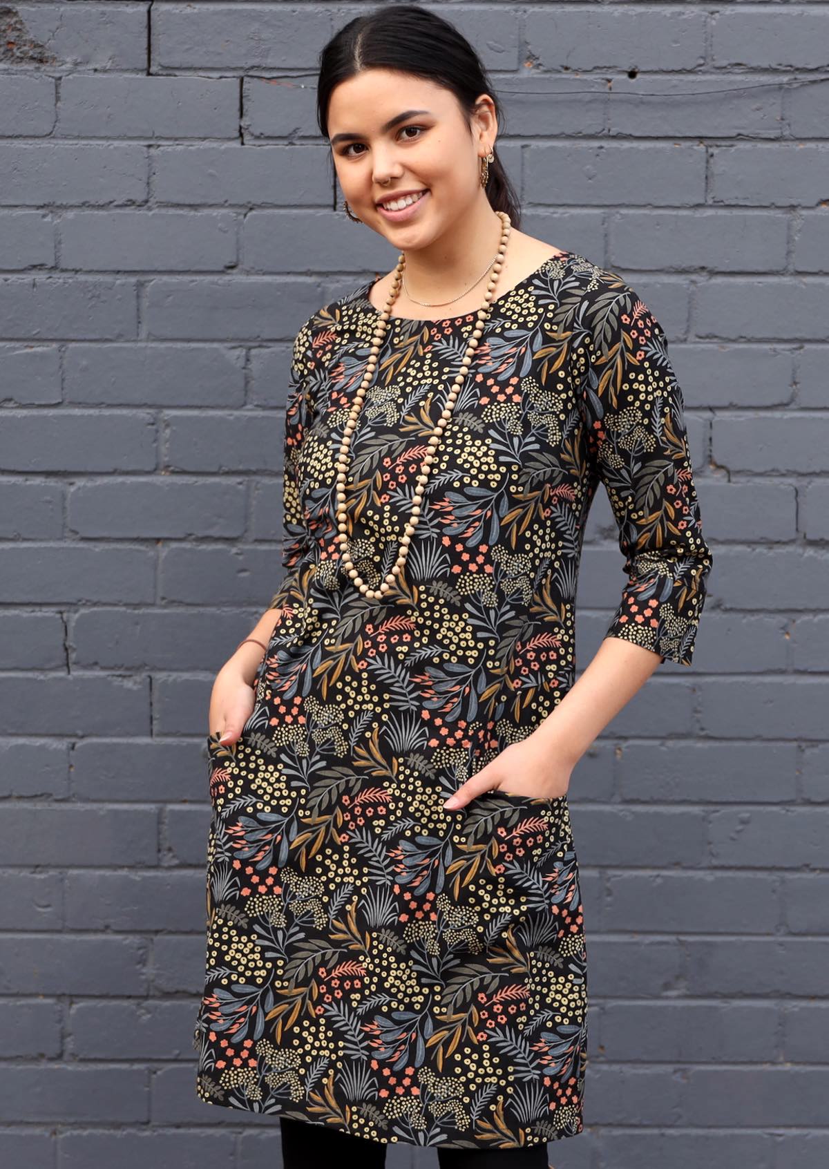 100% cotton 3/4 sleeve shift dress with pockets in gorgeous native floral print on black base