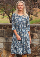 Cotton dress with round neckline with keyhole in centre and 3/4 sleeves with cuff detail