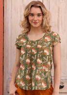 Beautiful green, orange and yellow floral print on green base cotton short sleeve top