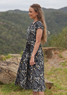 Cotton shin length dress can be cinched at the waist with fabric belt tie, or a belt